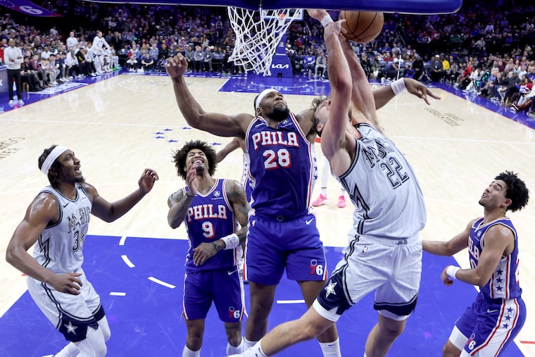 Guerschon Yabusele (left) fouls the Magic's Franz Wagner during the second half Wednesday at the Wells Fargo Center. Without Joel Embiid and Andre Drummond, the Sixers were at a size disadvantage, but they'll get another chance at the Magic on Friday.