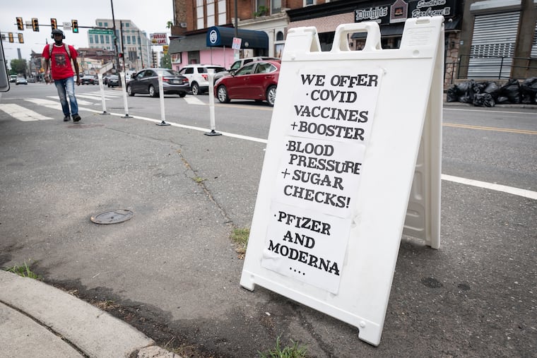 A sign with information for the August 2022 mobile clinic collaboration with Miriam Medical Clinics, Zion Baptist Church, and Temple University.